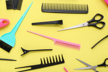 Composition with hairdressing accessories on yellow background