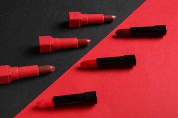 Composition with beautiful lipsticks on color background