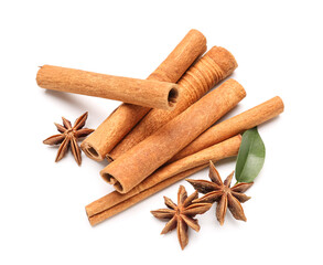 Cinnamon sticks with anise and leaf on white background