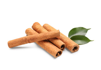Cinnamon sticks with leaves on white background