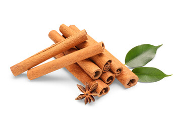 Cinnamon sticks with leaves and anise on white background