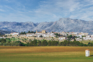 Fototapeta na wymiar panoramic view of the city of ronda ,andalucia,spain with huge mountains in the background and farmland in the foreground