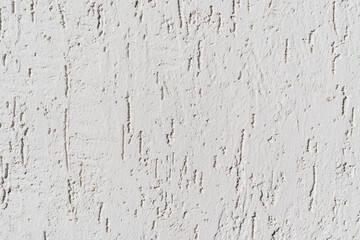 The surface of the wall with the texture of decorative plaster. 