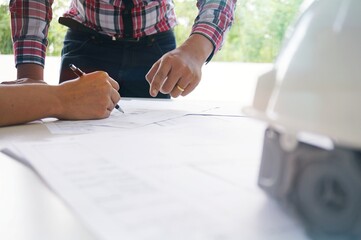 Colleagues interior designer Corporate Achievement Planning Design on blueprint Teamwork Concept...