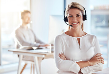 Portrait, customer support and smile with a woman consultant working in her office for after sales service. Call center, contact us and crm with a young female employee consulting using a headset