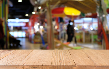 Empty dark wooden table in front of abstract blurred bokeh background of restaurant . can be used for display or montage your products.Mock up for space.