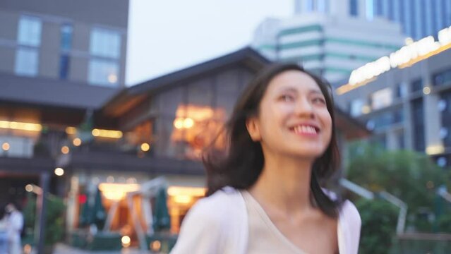 girl walking quickly on the streets of Chengdu, with smile, full of confidence and vitality