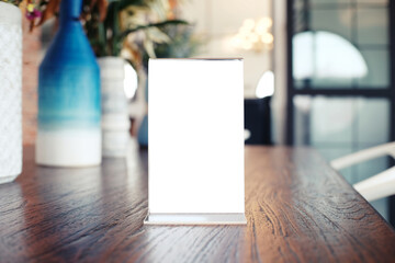 Menu frame standing on wood table in Bar restaurant cafe. space for text marketing promotion.