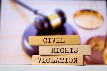 Wooden blocks with words 'CIVIL RIGHTS VIOLATION'. Legal concept
