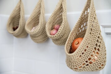 vegetable garlic onion hanger in white kitchen home apartment residential decoration interier design