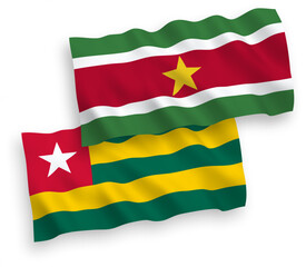 Flags of Togolese Republic and Republic of Suriname on a white background