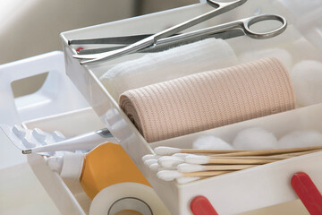 The bandages along with the first aid kit are in the first aid box.