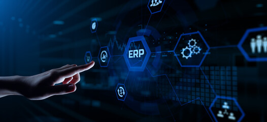 ERP Enterprise Resources planning software system business process automation concept. Hand pressing button on screen.