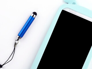 Phone in a silicone case top view. Smartphone and stylus on a white background. Using a phone...