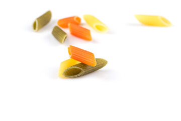 Raw colored pasta isolated on white background