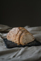 Artisan Batard Sourdough healthy Bread. Open crumb high hydration Sourdough french country bread set on dark background. - 594565225