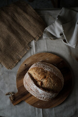 Artisan Batard Sourdough healthy Bread. Open crumb high hydration Sourdough french country bread set on dark background. - 594565238