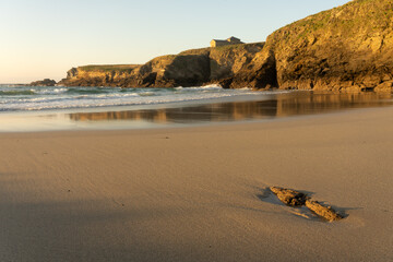 Santa Comba hermitage in the Santa Comba beach in the coast of Galicia at sunset in a sunny day. A...