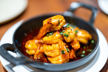 Grill shrimp with sauce on the plate in restaurant