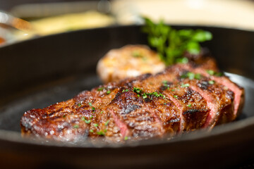Juicy steak sliced on the plate in restaurant