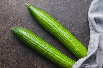 Fresh green cucumbers on kitchen table. Top view.