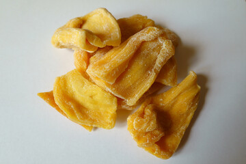 Closeup of group of fleshy yellow dried jack fruit chips
