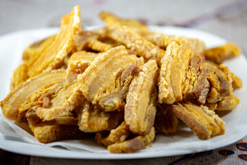 Typical crispy pork rinds in selective focus