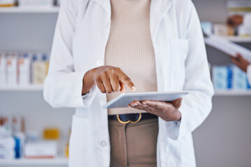 Doctor, woman and hands on tablet for medical research, Telehealth or inventory at pharmacy. Hand...