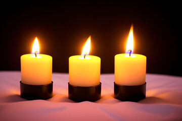 three burning candles in the dark. Memories and blessings