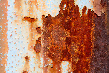 Rusted steel plate. Abandoned house, ruins. Metal. Background material. Stone, rock, etc…
