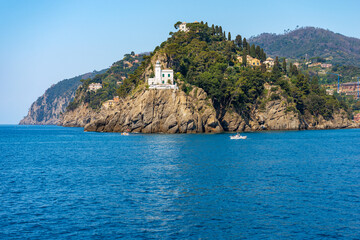Headland and white lighthouse of Portofino village, Genoa province (Genova), Liguria, Italy,...