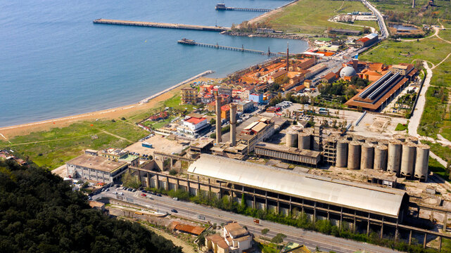 Aerial view of the ex Italsider area of Bagnoli from the Posillipo hill, in the metropolitan city of Naples, Campania, Italy. It's a disused industrial complex on the coast of Mediterranean sea.