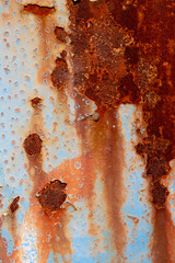 Rusted steel plate. Abandoned house, ruins. Metal. Background material. Stone, rock, etc… Blue.