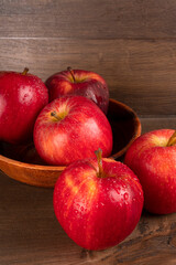 Red apple fruit isolated on wooden background