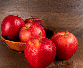 Red apple fruit isolated on wooden background
