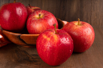 Red apple fruit isolated on wooden background