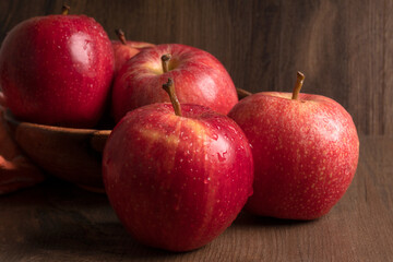 Red apple fruit isolated on wooden background
