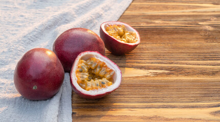 Fresh passion fruit on a wooden table.