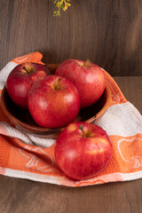 Red apple fruit isolated on wooden background