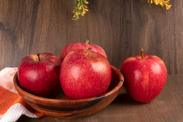 Red apple fruit isolated on wooden background