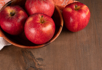 Red apple fruit isolated on wooden background