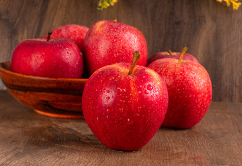Red apple fruit isolated on wooden background