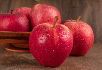 Red apple fruit isolated on wooden background