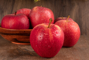 Fototapeta na wymiar Red apple fruit isolated on wooden background