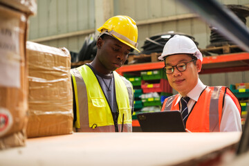 Group of Industrial workers working at a warehouse factory.