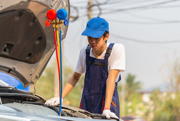 Technician man check car air conditioning system refrigerant recharge, Repairman with monitor tool to check and fixed car air conditioner system, Air Conditioning Repair