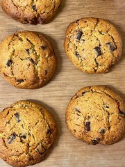 pistachio chocolate chip cookies on wooden table