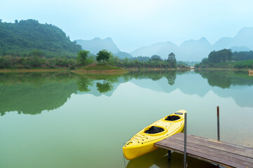 The lake and mountains, there is a kayak by the river