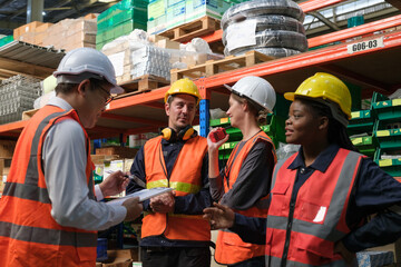 Group of Industrial workers working at a warehouse factory.