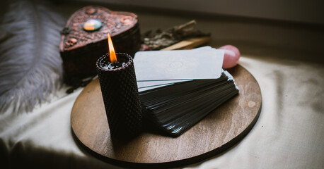 Magical attribute on a table, witchcraft concept, Candle fire, Spells and other rite
